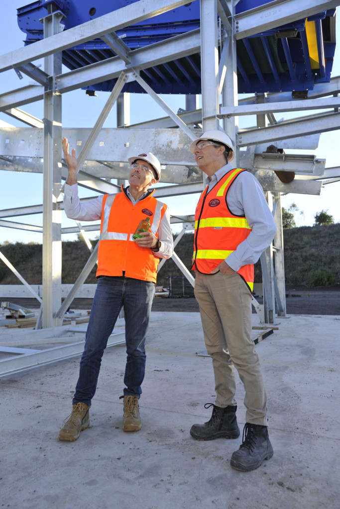 Alex Fraser MD Peter Murphy inspects the work at the company's new glass recycling plant with Hanson CEO Phil Schacht